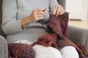 Senior woman knitting